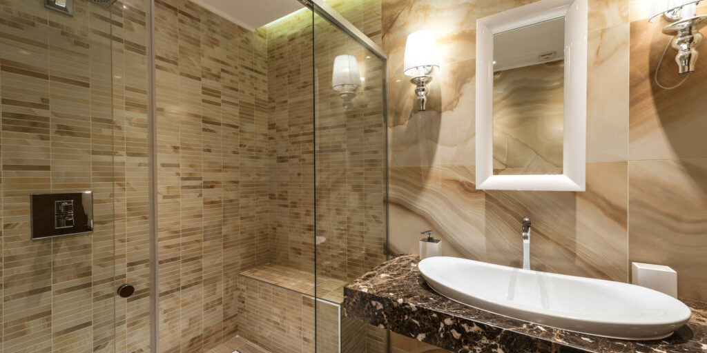 Luxury decorated bathroom, glass shower, sink and mirror Luxury decorated bathroom, glass shower, sink and mirror