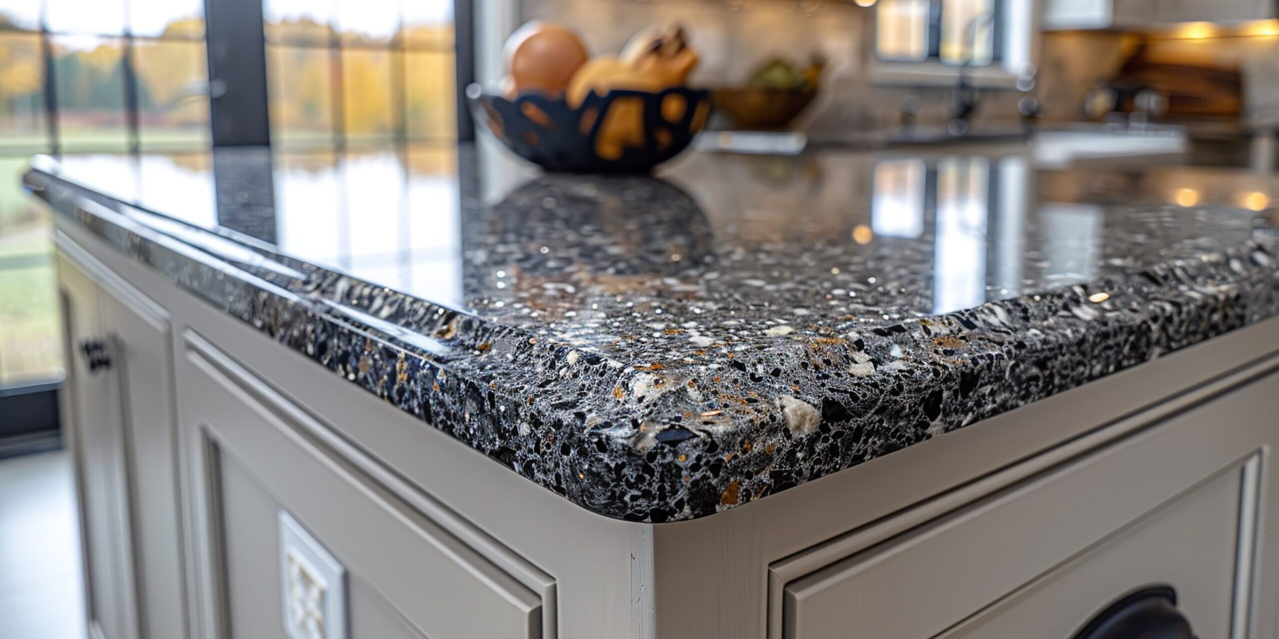 Close-up of a granite countertop with shimmering specks and natural variations, providing a high-end feel. Minimal and Simple,